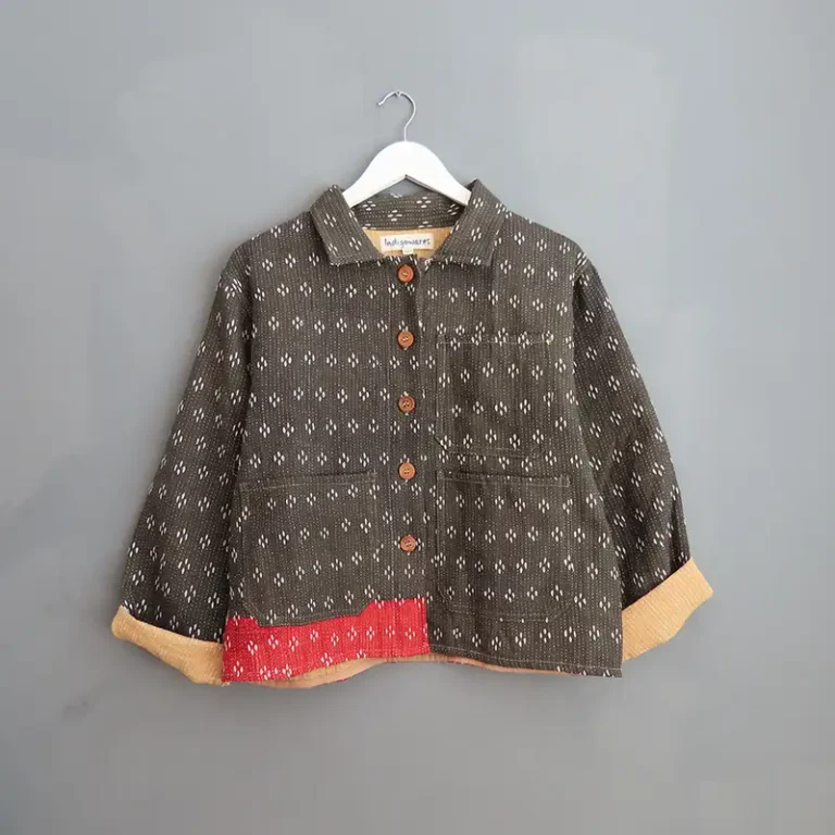 black kantha chore jacket hanging on a wall