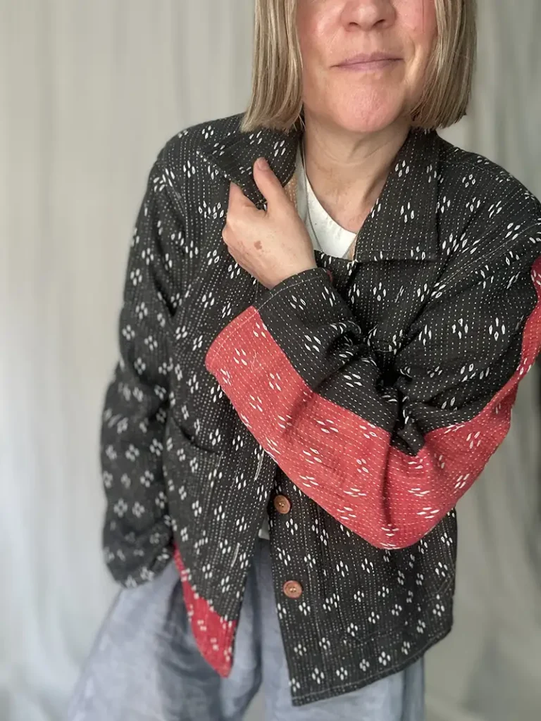 black kantha chore jacket on a woman