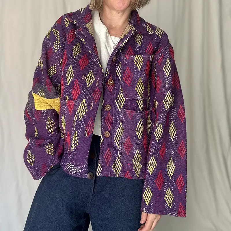 woman wearing purple pattern kantha chore jacket
