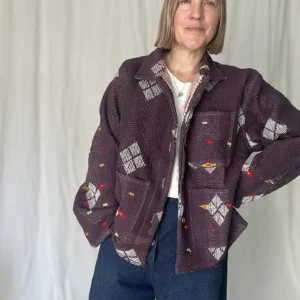 woman wearing a deep purple kantha embroidery jacket