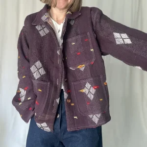 woman wearing a short kantha chore jacket