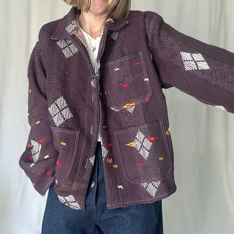 woman wearing a short kantha chore jacket