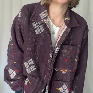 zoom in of woman wearing a kantha embroidery jacket