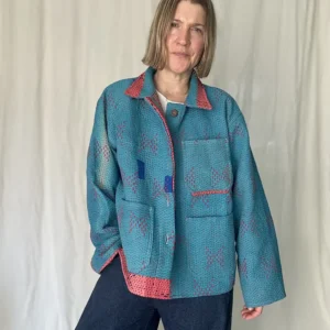woman wearing a sky blue kantha jacket