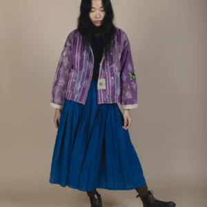 woman wearing a purple indigowares kantha fabric chore jacket