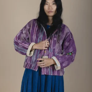 woman wearing a purple indigowares kantha fabric chore jacket