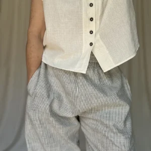 woman wearing pull on cotton trousers and white short shirt