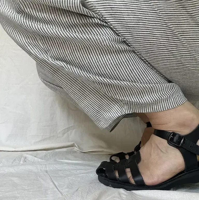 close up shot of fine black and white striped trousers