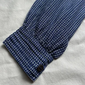 pin-tuck cuff details on blue check shirt