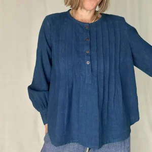 woman wearing indigo shirt with pintuck details