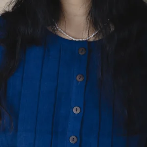 woman wearing indigo dyed cotton shirt