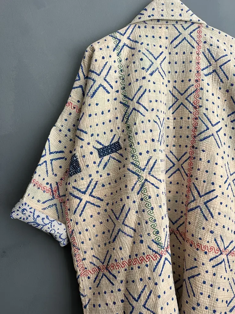 zoom in of blue and white kantha jacke