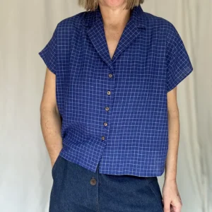 woman wearing blue check short sleeve shirt with jeans