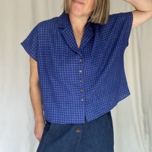 woman wearing blue check short sleeved shirt