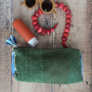 green kantha fabric pouch with toiletries