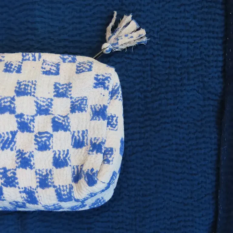 zoom in of blue checker zipped pouch