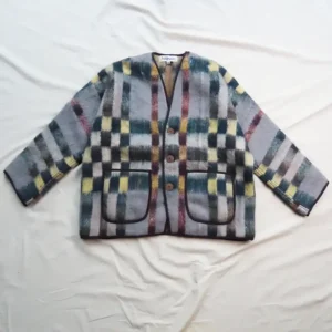 FLATLAY OF A BLANKET JACKET WITH NEUTRAL CHECK DETAIL