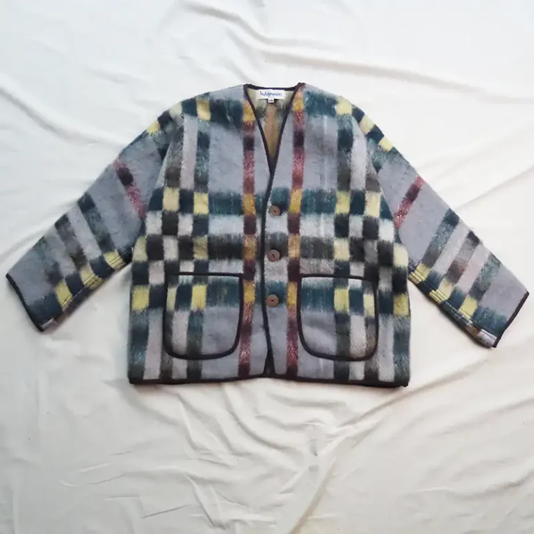 flat lay of grey and green check wool jacket