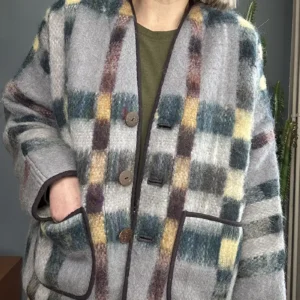 ZOOM IN woman wearing neutral check blanket jacket