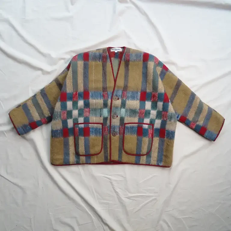 red check blanket jacket flat lay