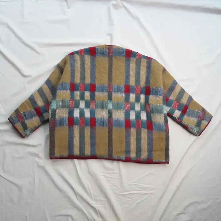 back of red check blanket jacket flat lay