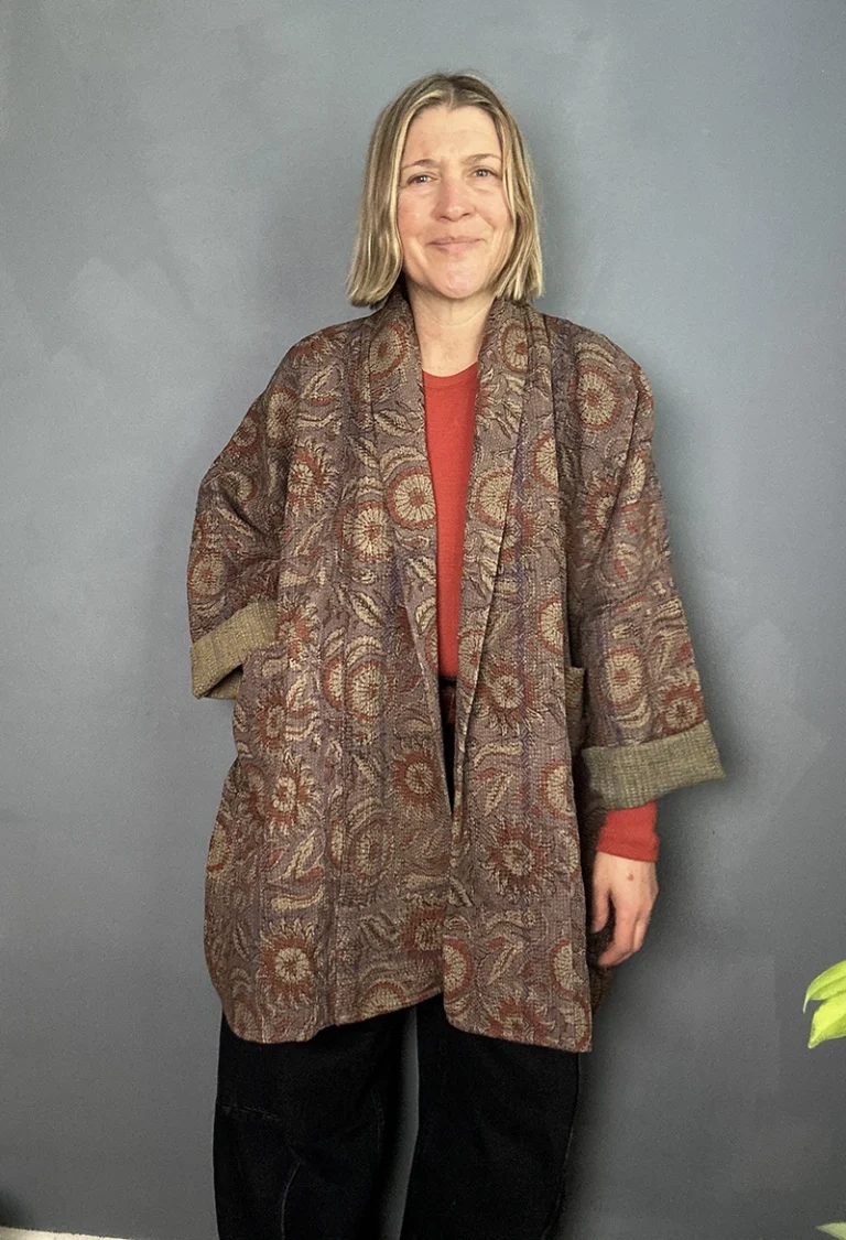 woman wearing long indian kantha jackets