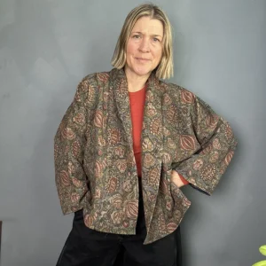 woman wearing an earthy toned kantha stitched jacket
