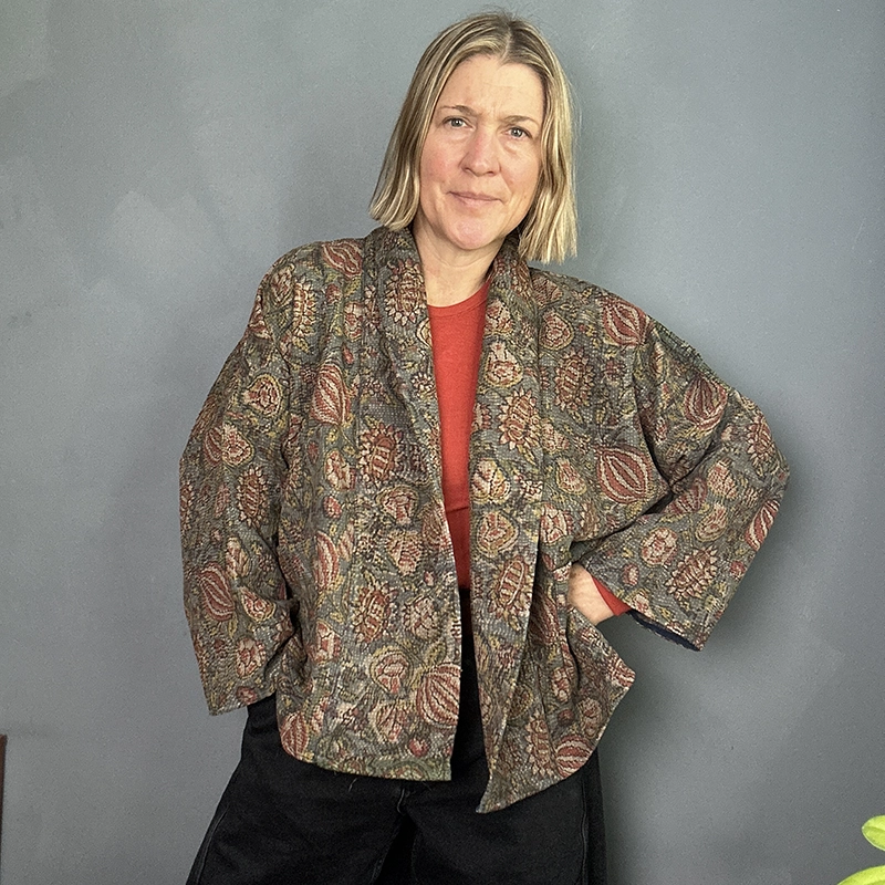 woman wearing an earthy toned kantha stitched jacket