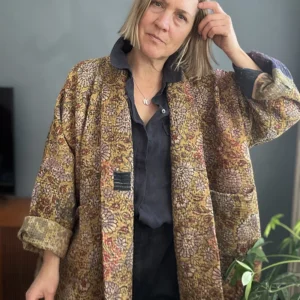 woman wearing dark long kantha style jacket