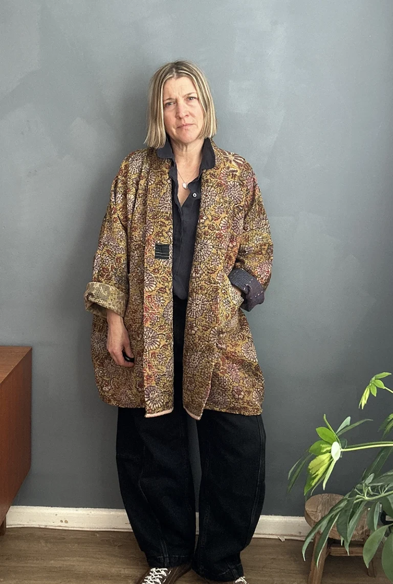 woman wearing indian kantha jacket