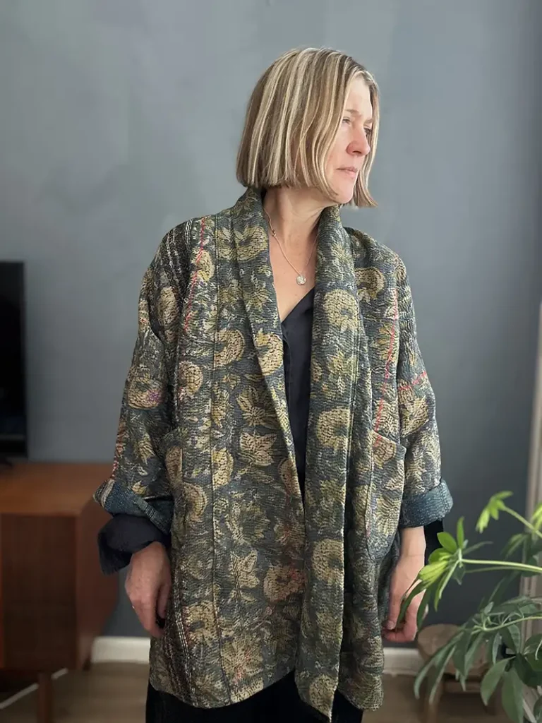woman wearing a long vintage kantha fabric jacket