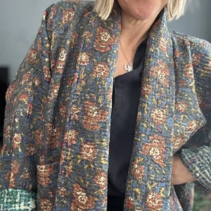 woman wearing a long vintage kantha jacket