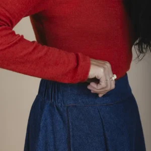 zoom in side view of woman wearing hemp denim skirt