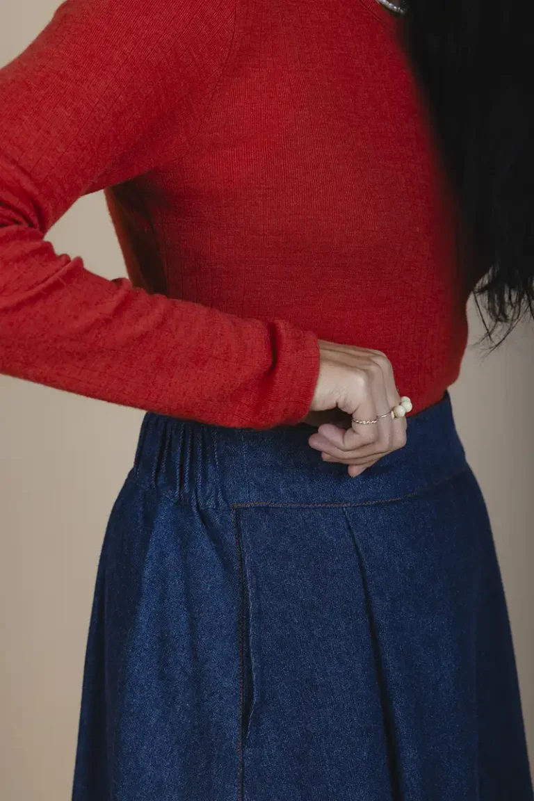 zoom in side view of woman wearing hemp denim skirt