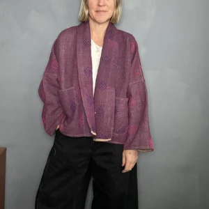 woman wearing deep wine coloured kantha quilted jacket