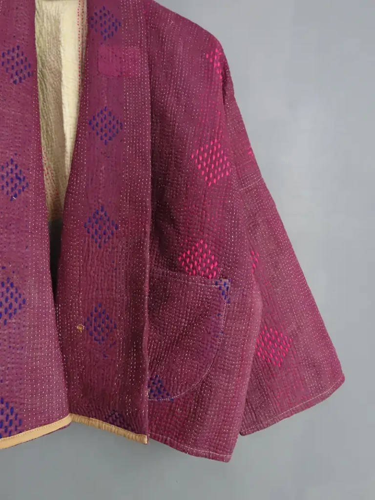 zoom in of deep purple kantha sticthing on a kantha jacket