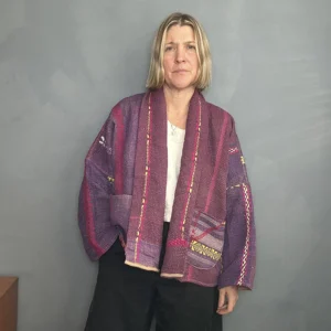 woman wearing a deep purple short vintage kantha jacket