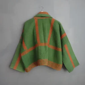 back view of a short green kantha jacket