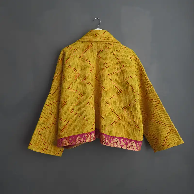 back view of a yellow kantha jacket