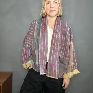 woman wearing muted purple short kantha jacket