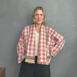 woman wearing a checkered short kantha jacket